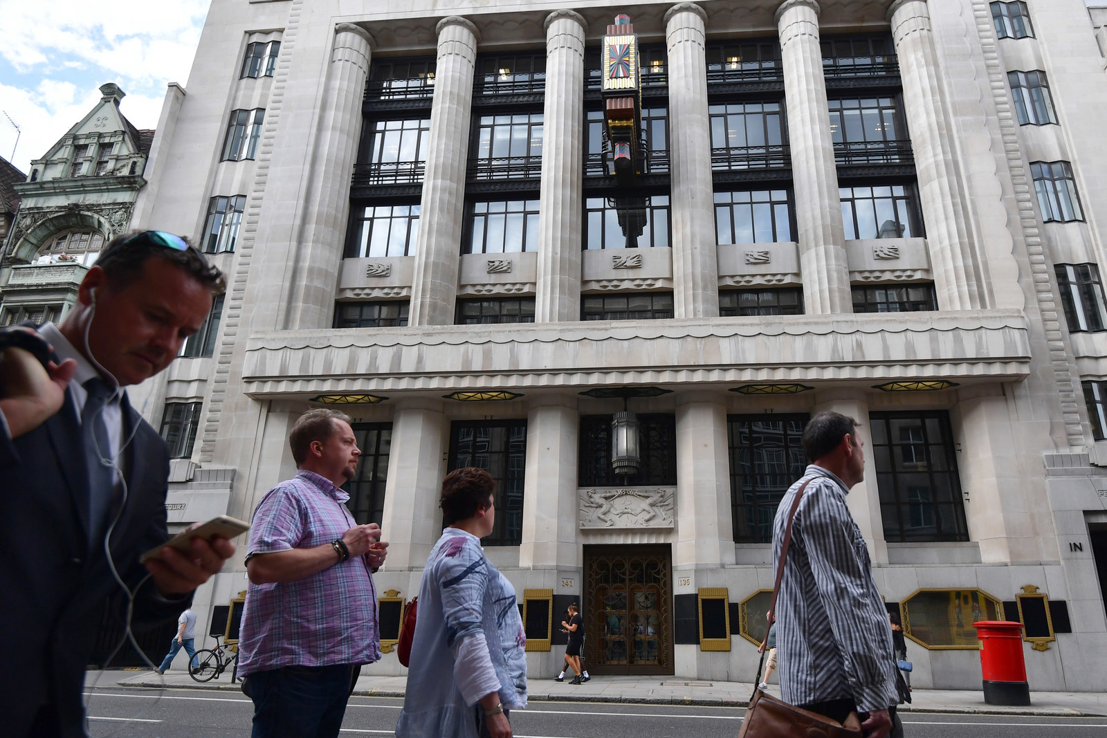 People walk past the former Daily Telegraph building in Fleet Street.