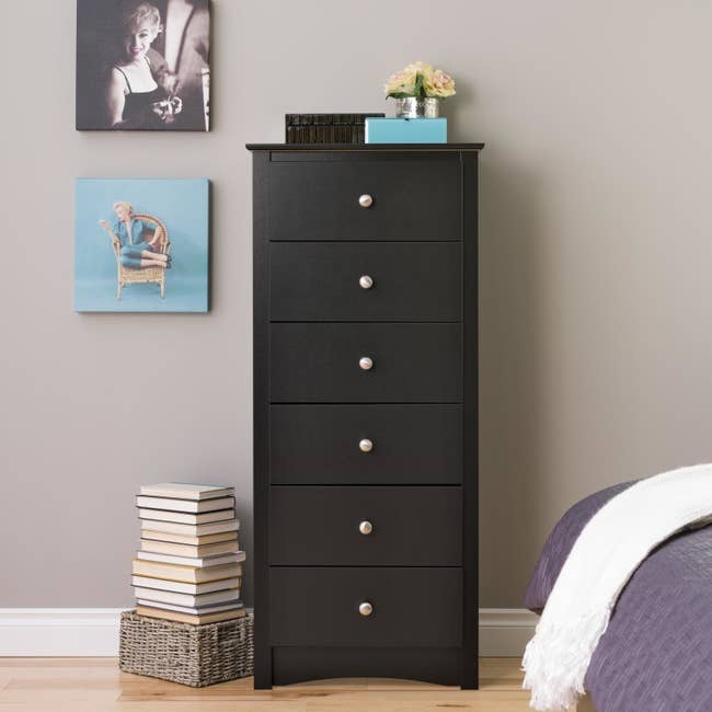 black six-drawer dresser in bedroom