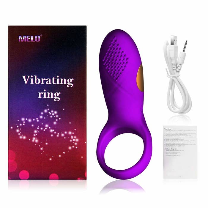 The purple ring with a long attachment and its charging cord
