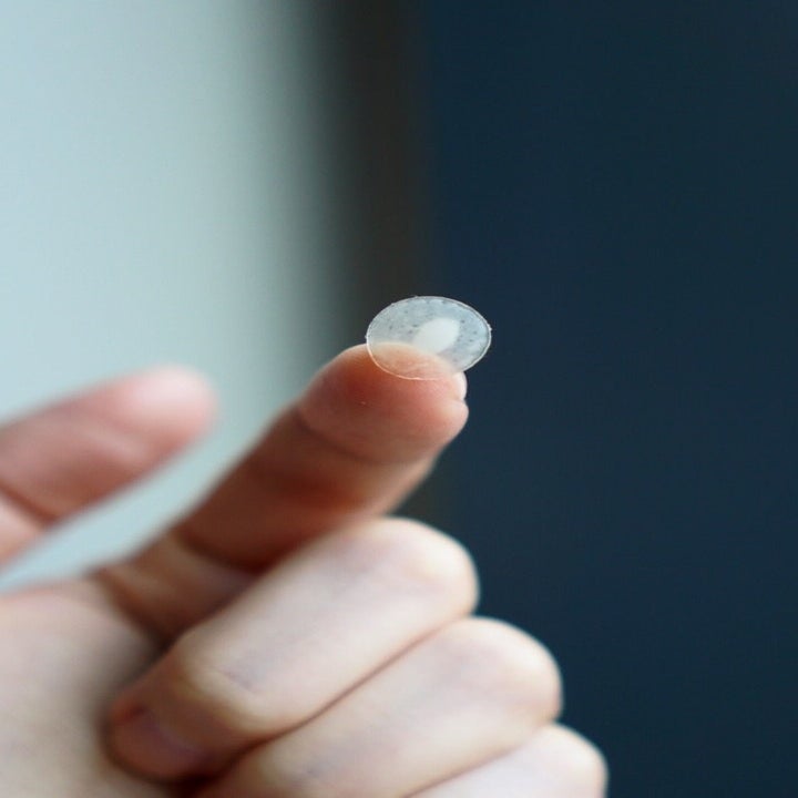 a used patch on the end of someone's finger