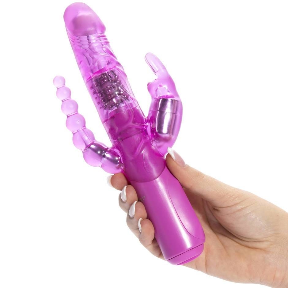 A hand holding the pink rabbit vibe with a graduated anal bead attachment