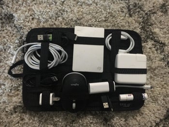 all the cords and wires and neatly wrapped and tucked into the cloth organizer 