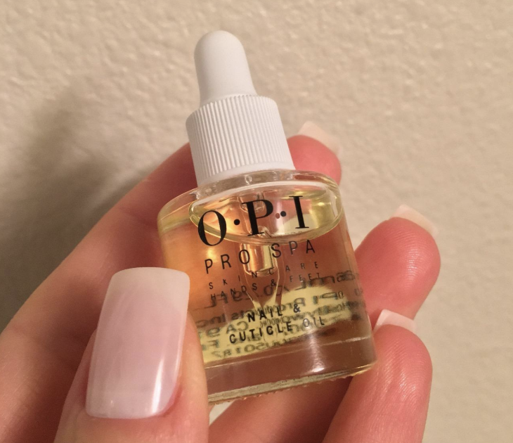 the bottle of opi nail and cuticle oil