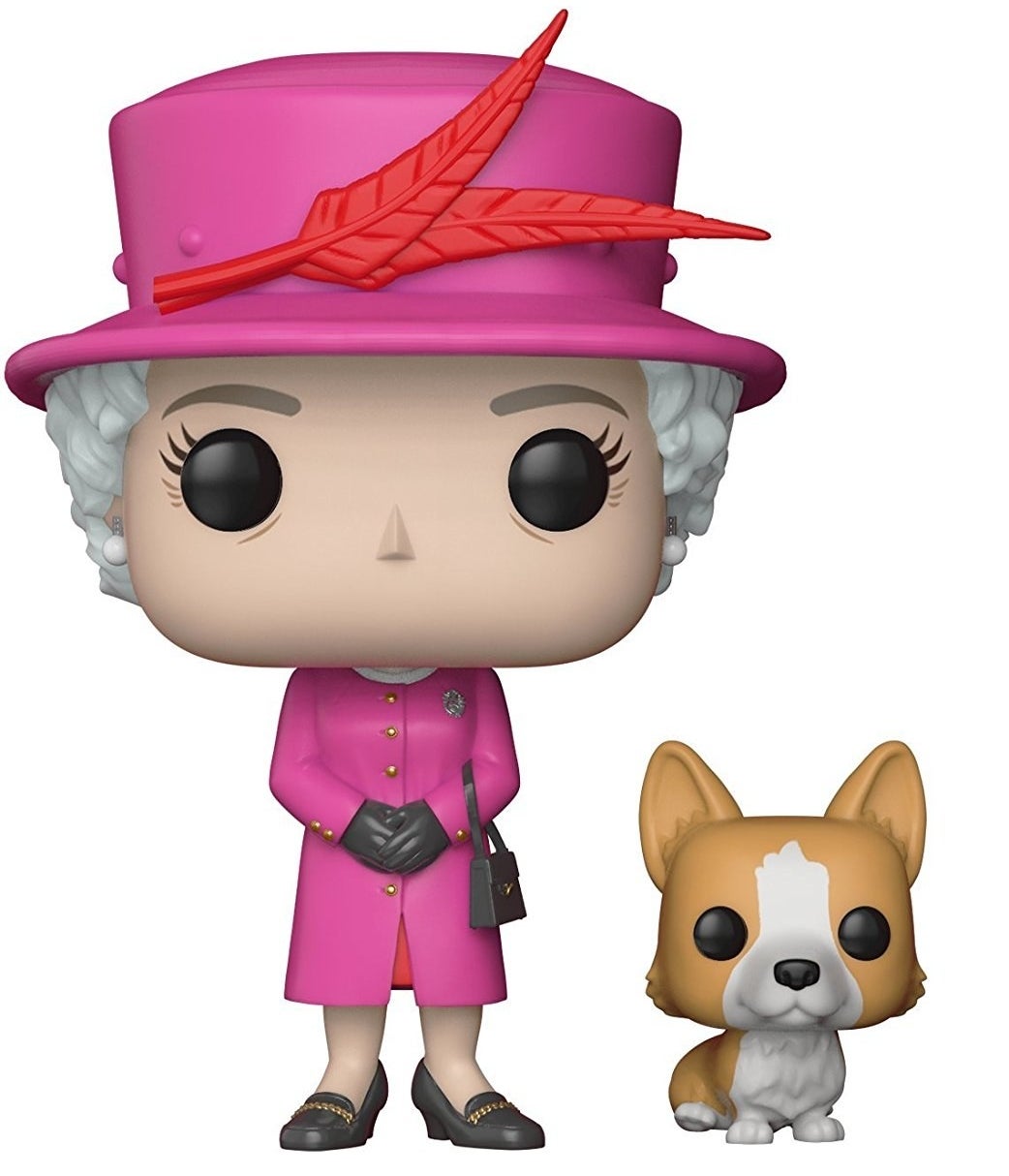 a funko pop of queen elizabeth in a pink coat with a corgi