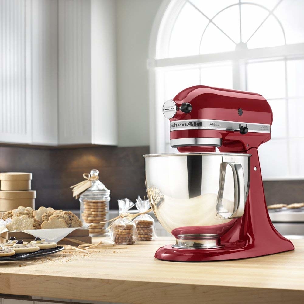 a red stand mixer on a countertop