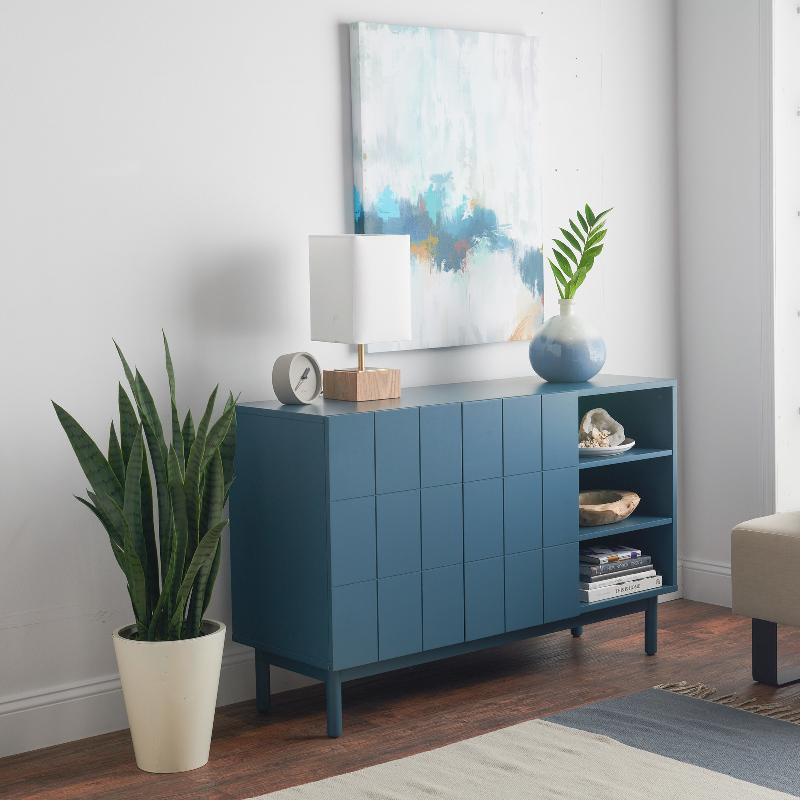 There's one adjustable shelf inside the doors and two open shelves. Price: $299 (available in blue and grey)