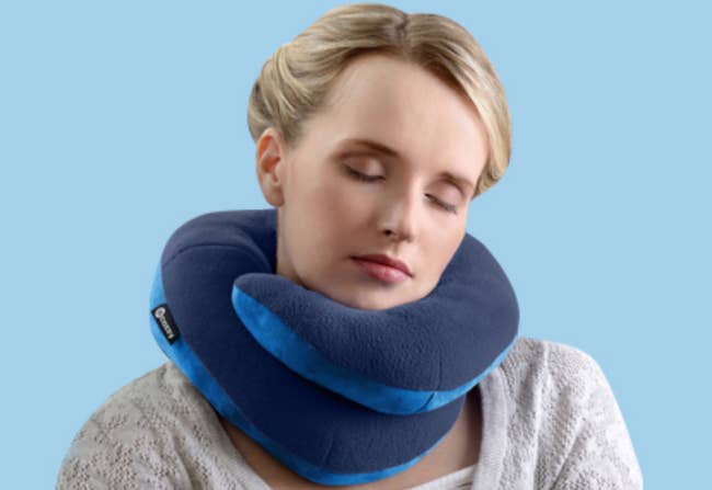 model with neck pillow wrapped around neck