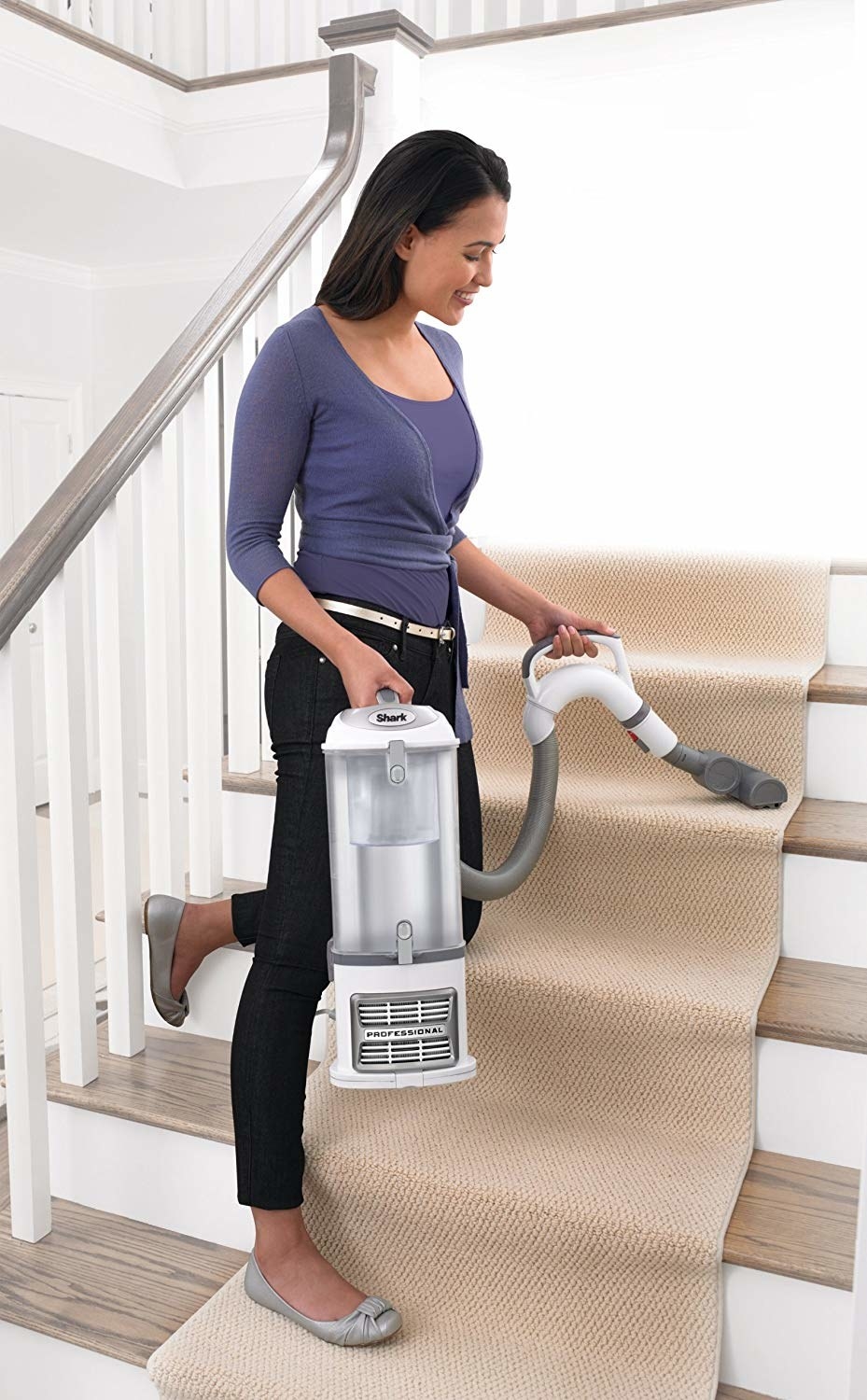 model using the vacuum on stair carpet
