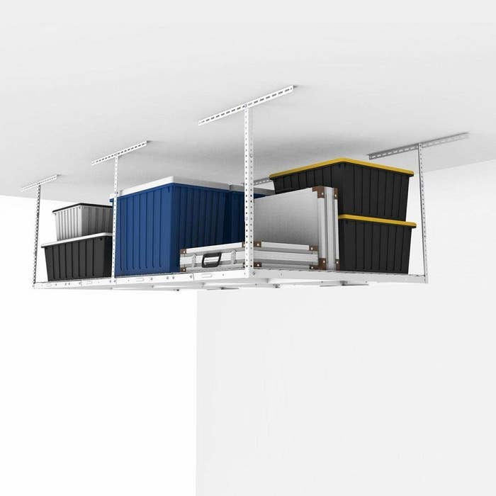the rack mounted to a garage ceiling with containers 