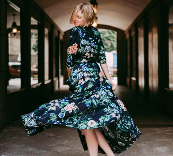 A customer review photo of them twirling in the dress