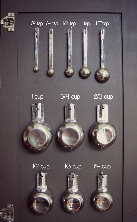 Get the measuring cup decals from Starstruck Industries on Etsy for $9.50 and an 80-piece screw hook set for $8.99, or the Command hook strips for $3.17+.
