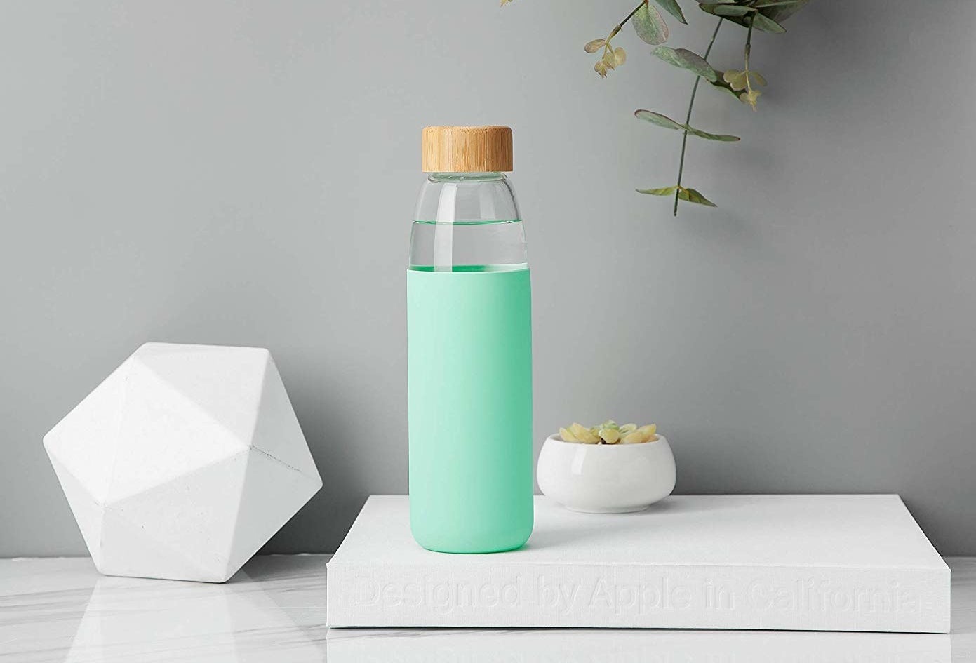 Not only is its glass frame shatter-proof and super durable, but its bamboo cap is leak-proof. AND its its sleeve is slip-resistant. Promising review: "I am the worst with drinking water, but so far this water bottle is awesome! It's a glass water bottle so it's very durable and comes with a rubber sleeve to keep it protected, but also it keeps condensation from wetting anything in my bag. I also like that it comes with two different types of tops. Both are leak-proof. I highly recommend this bottle to anyone who is looking for a conveniently sized, sleek-looking bottle to keep you hydrated. I've tried a lot of water bottles and so far this is my favorite! I will likely buy another one in a different color to have a collection going." —Chloressa NeblinaGet it from Amazon for $15.99 (available in eight colors).