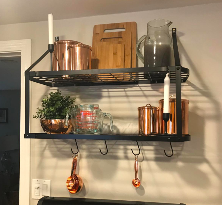 Reviewer image of the organizer hung above their stove 