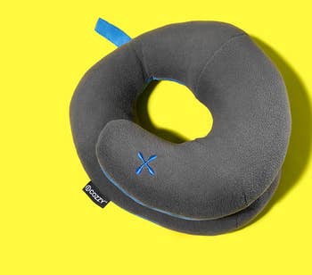the grey travel pillow in an O shape