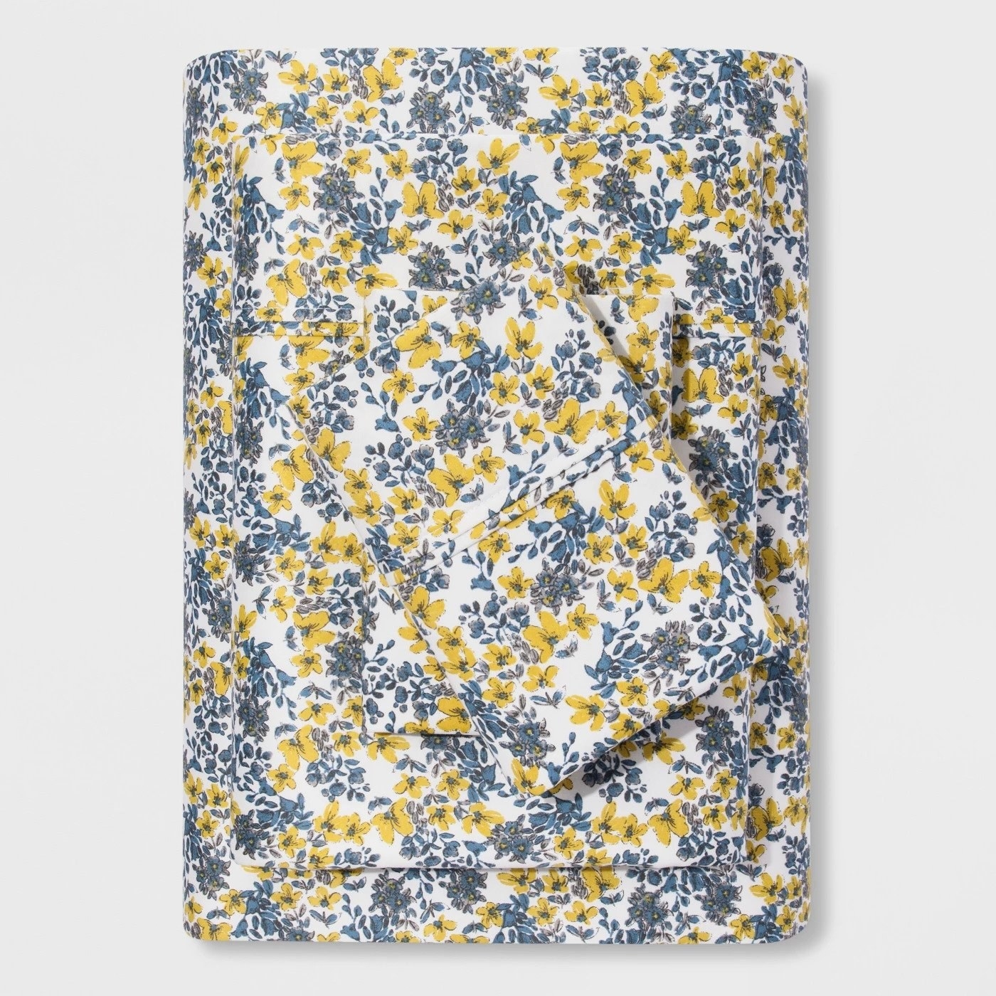 the sheet with a yellow and blue floral pattern 