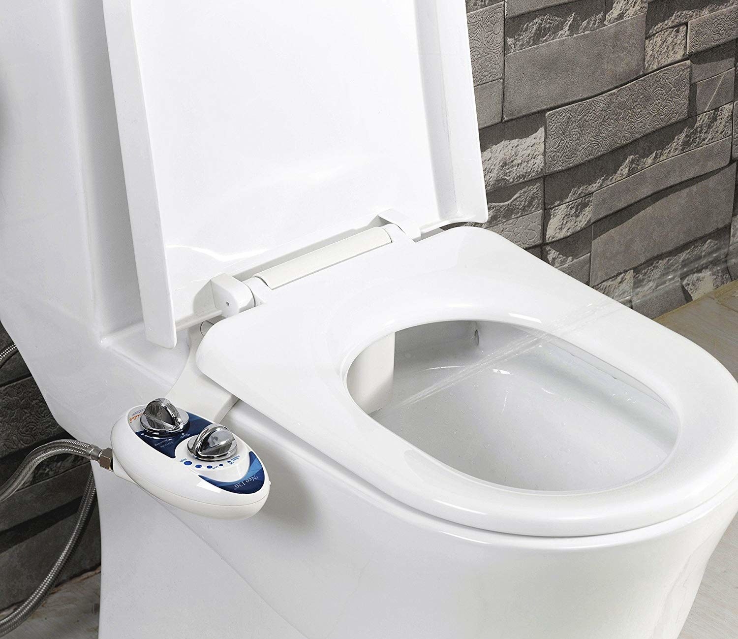 bidet attachment installed on toilet with two control knobs