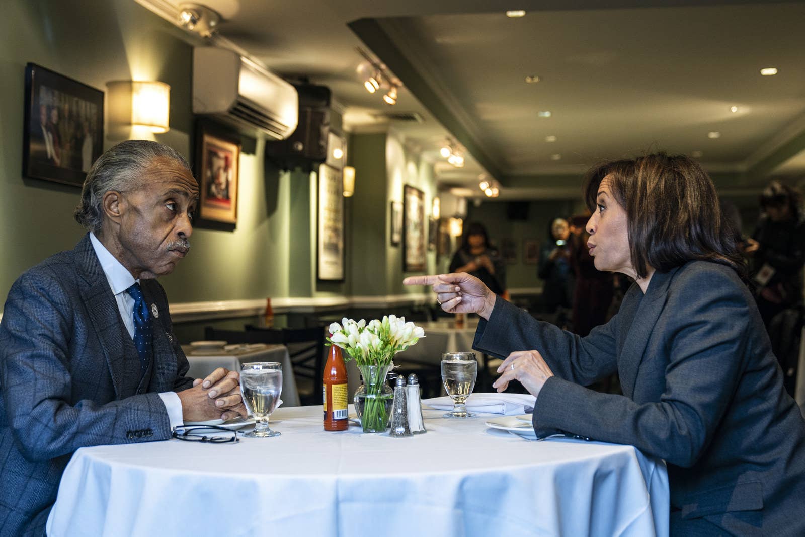 Rev. Al Sharpton and Sen. Kamala Harris, a 2020 Democratic presidential candidate, talk while having lunch at Sylvia&#x27;s Restaurant on Feb. 21, in Harlem, New York City.