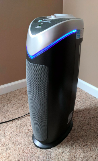 The black standing air purifier in a reviewer's home