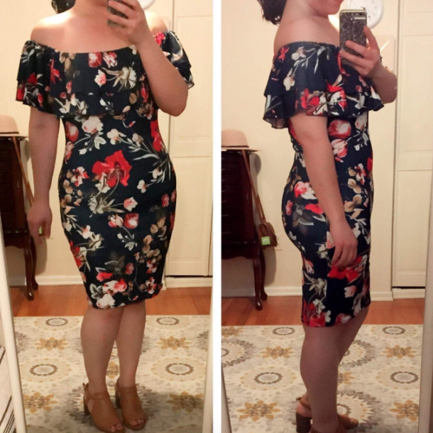 reviewer wearing midi off-shoulder navy dress with floral design