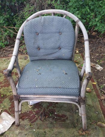 A reviewer showing a gray chair