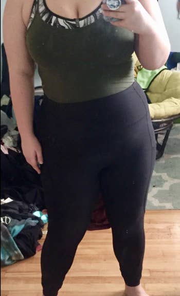 a reviewer wearing the high-waisted leggings in black