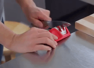 a moving GIF of a model using the knife sharpener