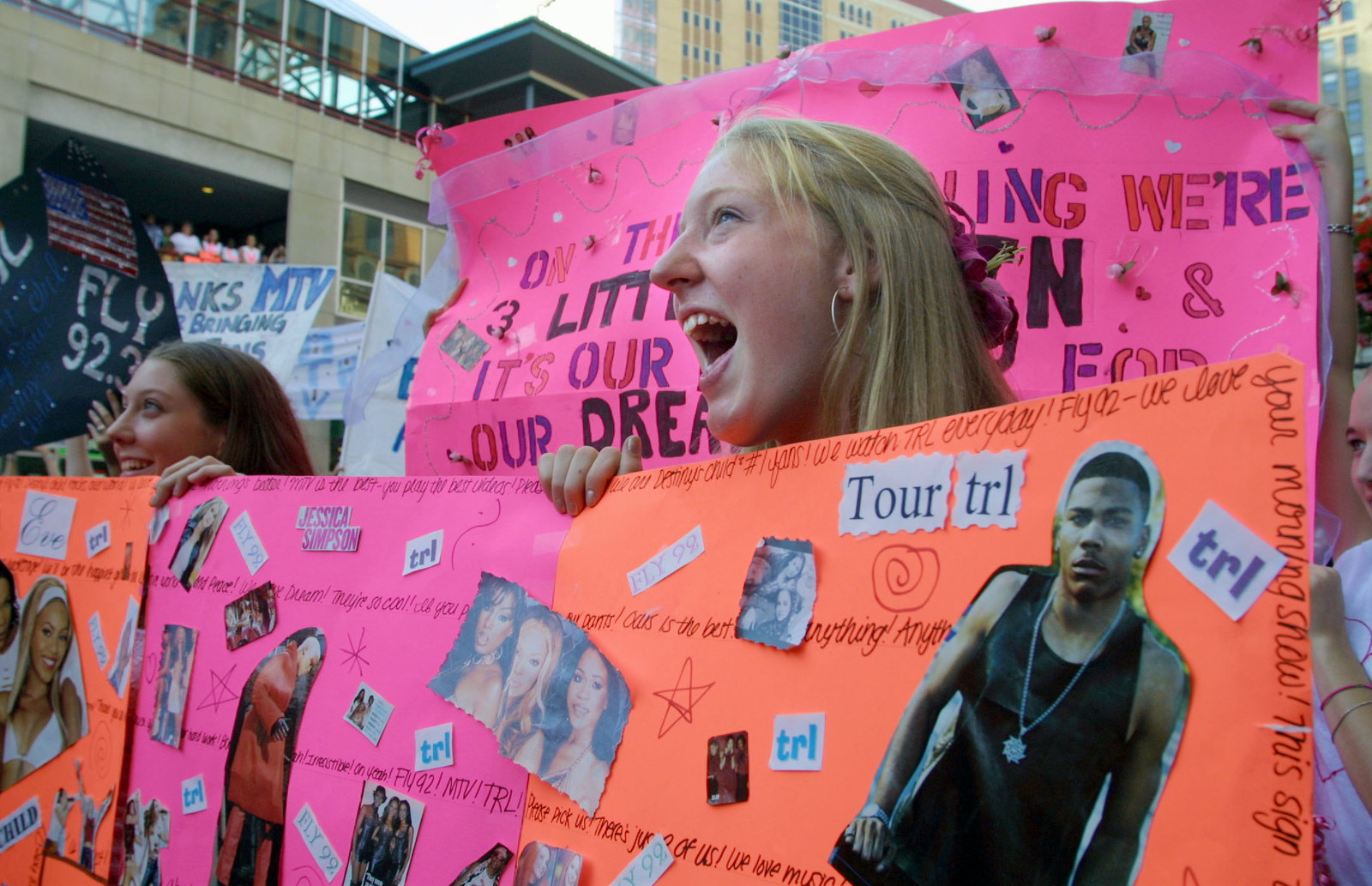 fans holding signs