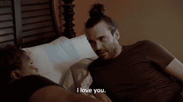 GIF from Queer Eye of Johnathan Van Ness and a participant in the show saying &quot;I love you&quot; to one another