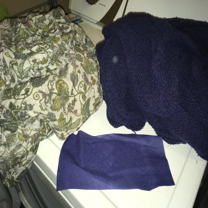a load of laundry after being washed with the dye-trapping sheets