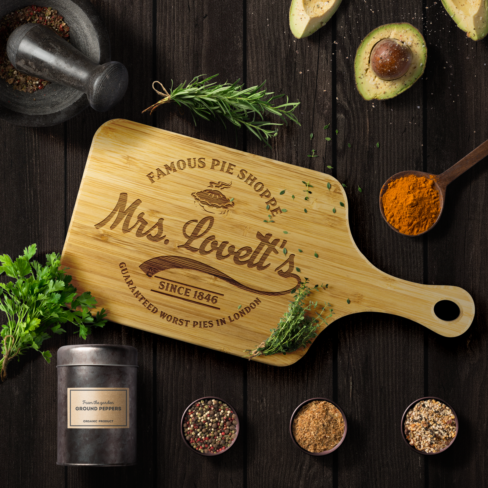 Rectangle wood cutting board with a handle and laser engraved logo for Mrs. Lovett's famous pie shoppe