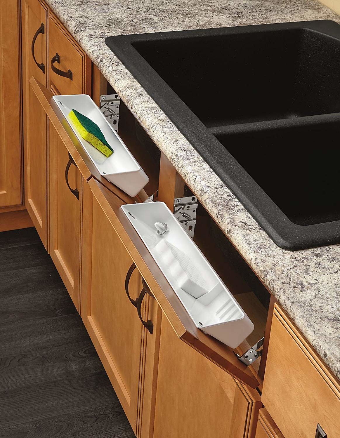 the &quot;fake&quot; drawers under a sink converted so they tip open to reveal a shallow white caddy that fits sponges