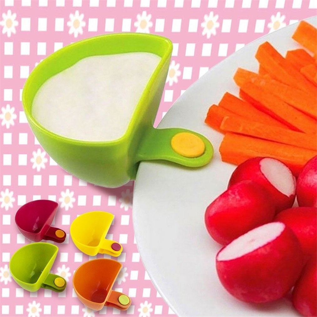 Promising review: "These little dip bowls are the perfect size. I wasn't expecting them to hold on so well. They work great with any size plate. I love them." —S CoatesGet a set of four from Amazon for $6.99.