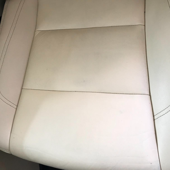 Same reviewer's after photo showing the leather cleaner got rid of the denim stains