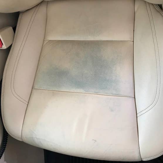 Clean after washing the front passenger seats of matte beige genuine  leather inside the interior of an expensive suv, preparation before selling  the car. Auto service industry. detailing cleaning. Stock Photo
