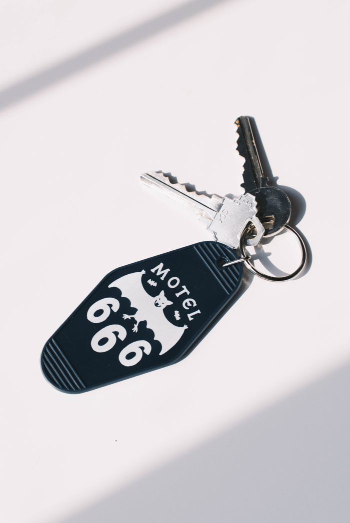 keychain with bat that says motel 666