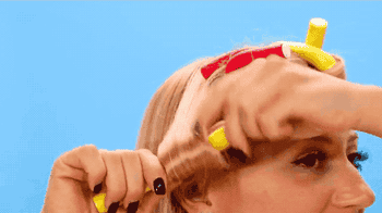 gif of model using curlers 