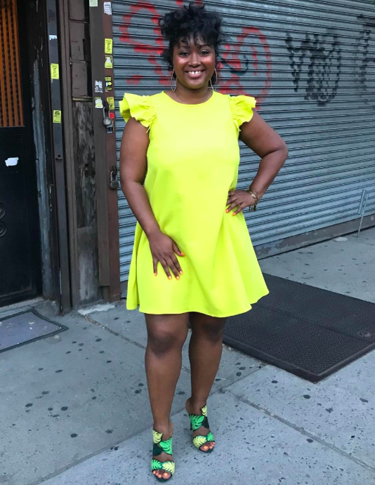 A customer review photo of them wearing the dress in yellow