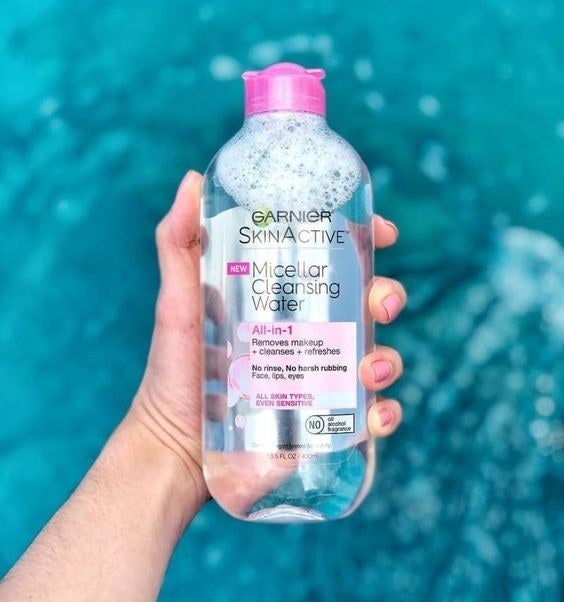hand holds clear bottle of Garnier SkinActive Micellar Cleansing Water