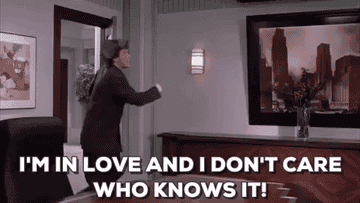 A gif of Wil Ferrell throwing from the movie Elf that says, &quot;I&#x27;m in love and I don&#x27;t care who knows it!&quot;