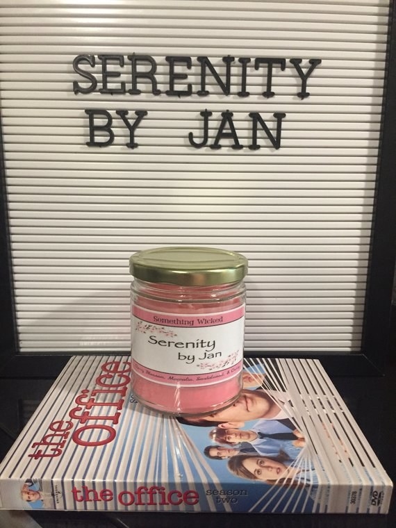 candle with a &quot;Serenity by Jan&quot; label