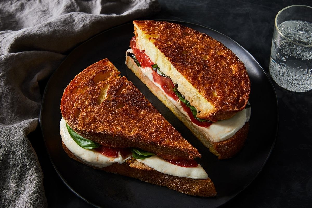 Caprese Grilled Cheese halves on a plate