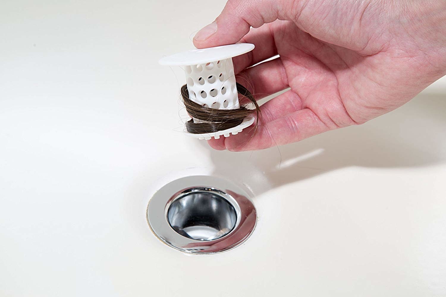 mushroom shaped device that collects hair from drain