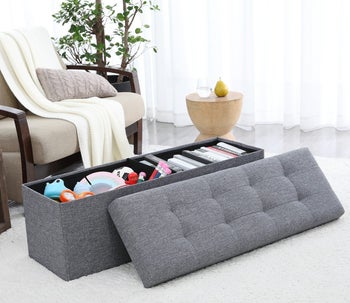 books and toys organized inside of a grey ornavo home storage ottoman