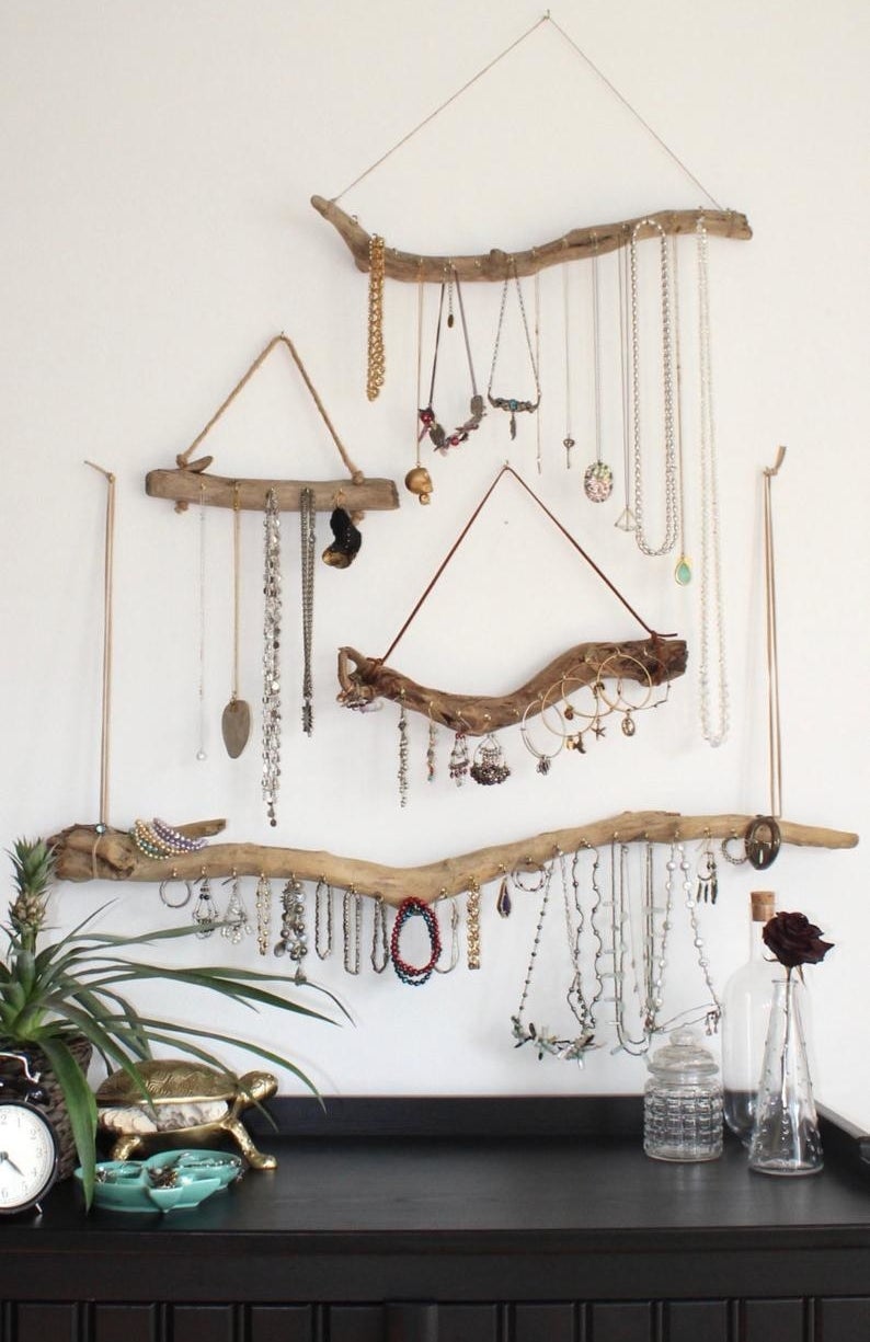 different styles of the wood jewelry organizer hung on a wall