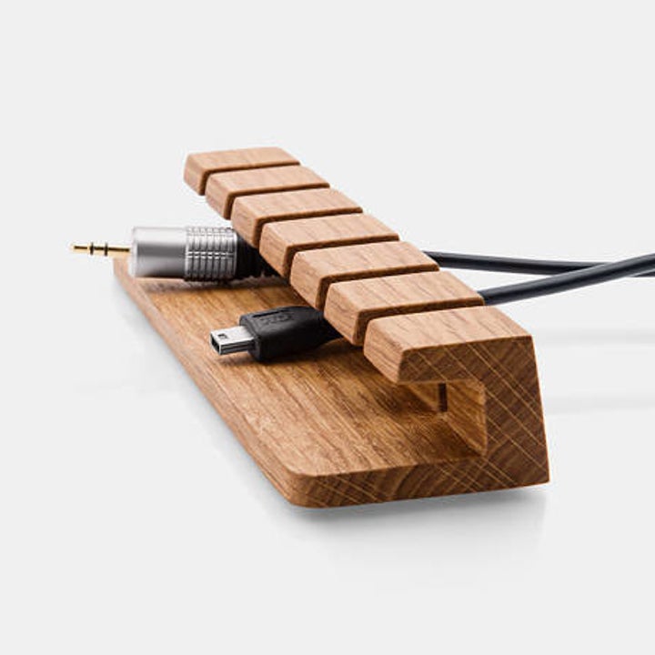 wood organizer with cables slotted in and held up