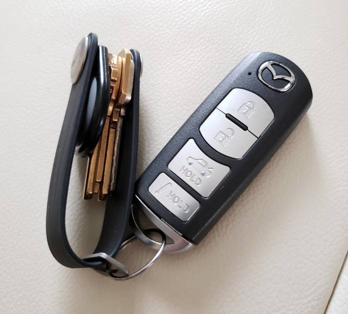 Reviewer image of rubber key holder attached to a key fob with four keys neatly tucked away inside of it
