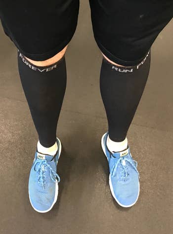 runner wearing black compression sleeves