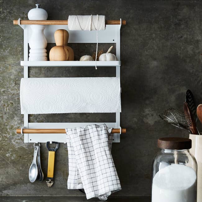 close up of the steel and wood magnetic fridge rack hanging in a kitchen