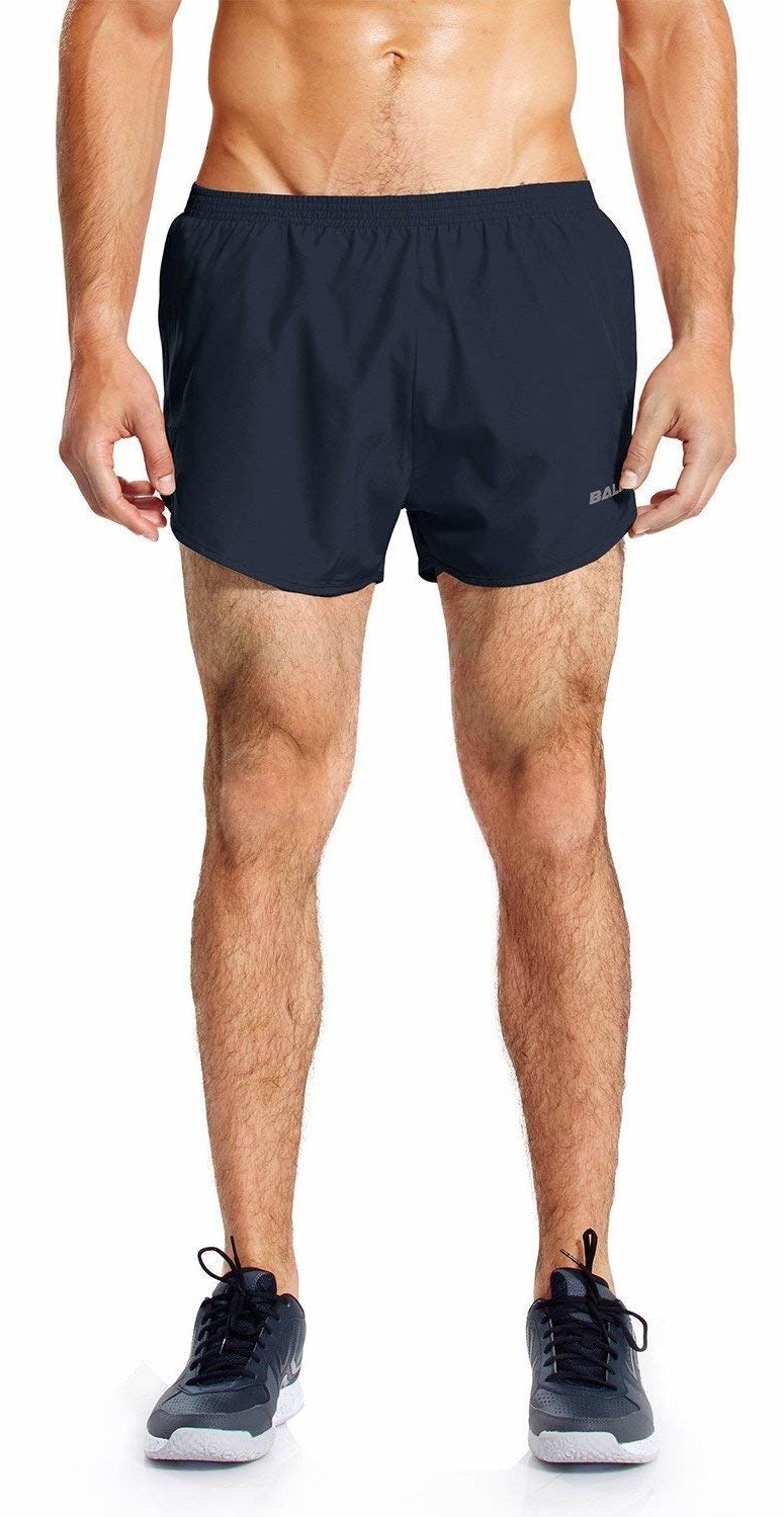 model wearing navy blue running shorts