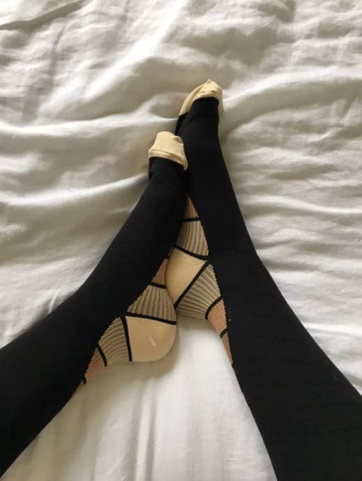 Promising review: "With three weeks of international travel coming up, I purchased these to combat swelling in my feet during the flights. I had noticed swelling after three hour domestic flights, so I was worried about what almost 30k miles would do! I wore these on every leg of the trip and never noticed any swelling — even after the 10-15 hour flights. They are very comfortable, too!" —J. Beaty Get them from Amazon for $14.95+ (available in sizes S-XL and in nine colors). Check out a BuzzFeeder's review of these compression socks.